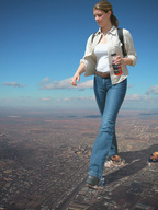 giantess city mega destruction jeans brunette ponytail unknown_artist walking shoe_crush aerial_view