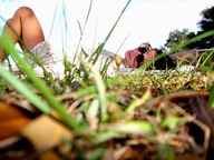 giantess lying_down voyeur sunglasses outdoors floor_view point_of_view