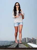 giantess collage city mega black_hair long_hair clothed traffic phone legs shorts walking sunglasses flip_flops road bag