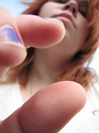 finger looking_down captured between_fingers point_of_view