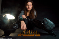 brunette boots chess photograph