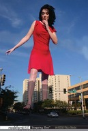 giantess collage city black_hair cars buildings dress legs sky sunny