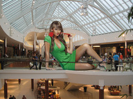 breasts giantess collage wonderslug legs sunglasses flower manicure pedestrians shopping_mall green_dress melissa_giraldo